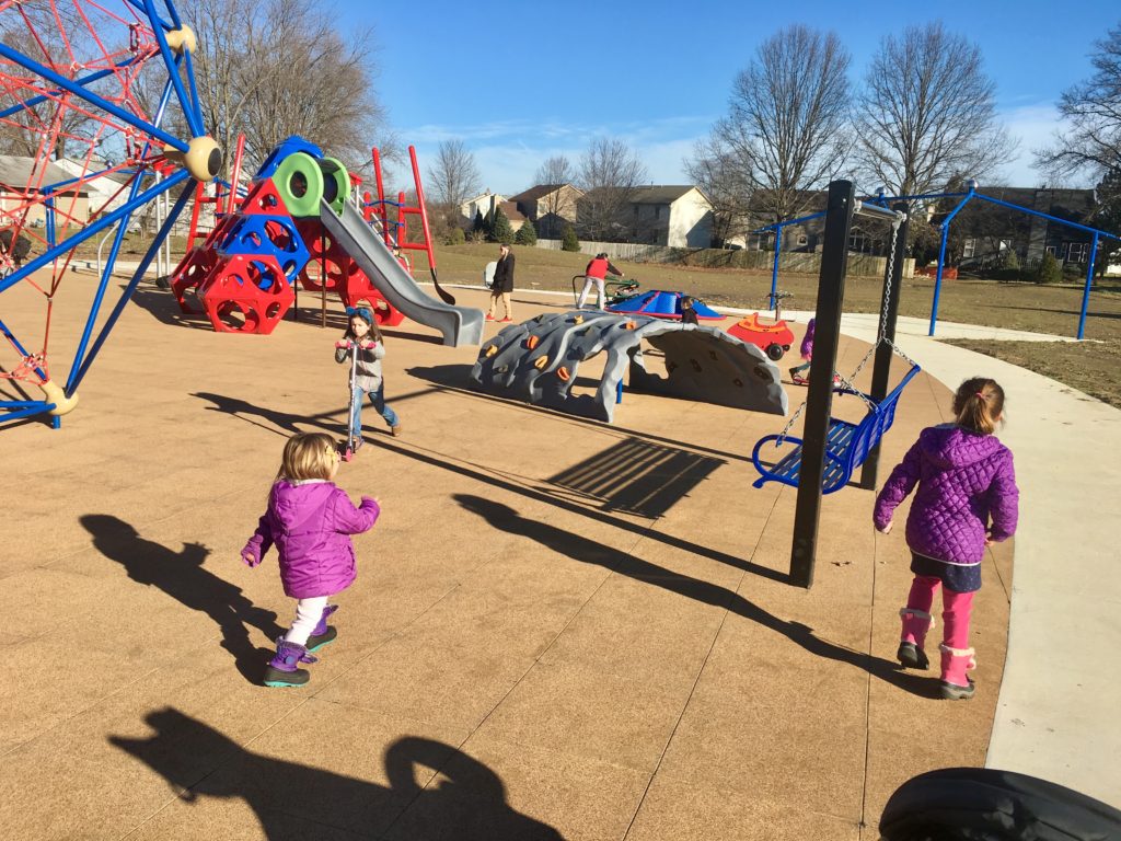 Children on the playground at Sunpoint Park.