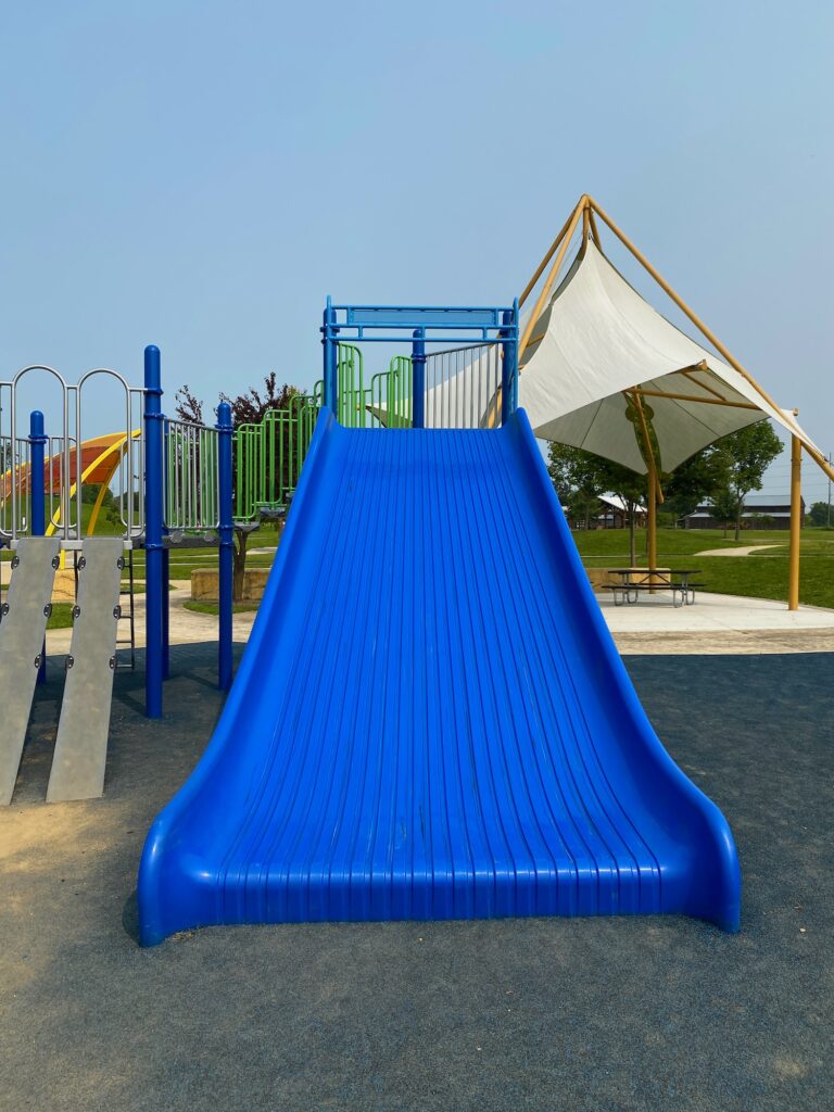 A super wide, blue slide at Fryer Park.