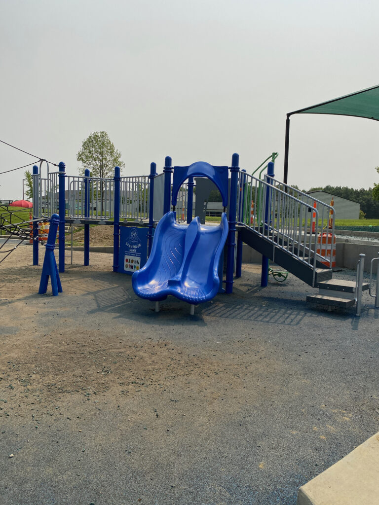 A smaller play structure for toddlers with two slides.