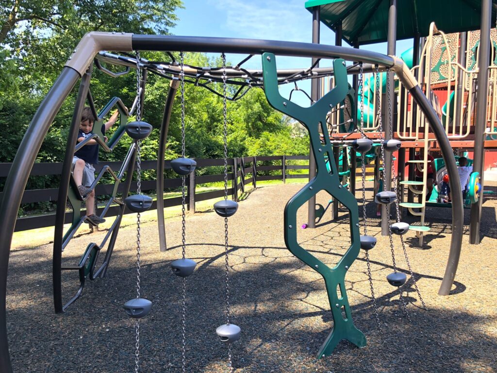 A boy climbing on playground equipment at Gantz Park.