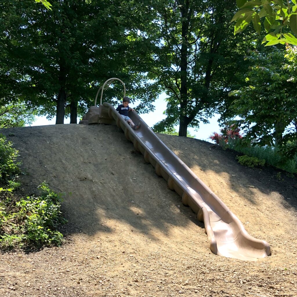 A boy going down the large slide at Gantz Park in Grove City.