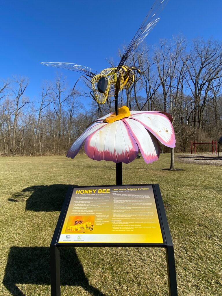 A honey bee sculpture at Academy Park.