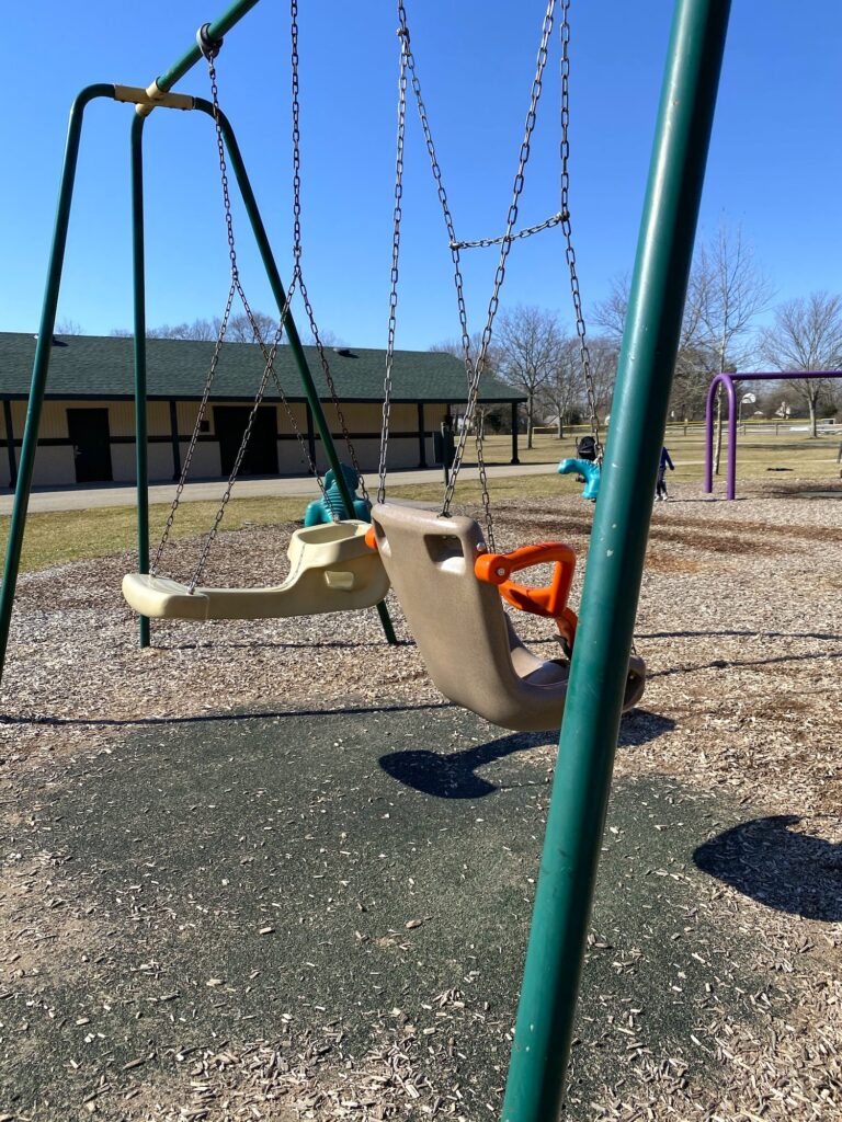 Face to face and toddler swings at Academy Park in Gahanna.