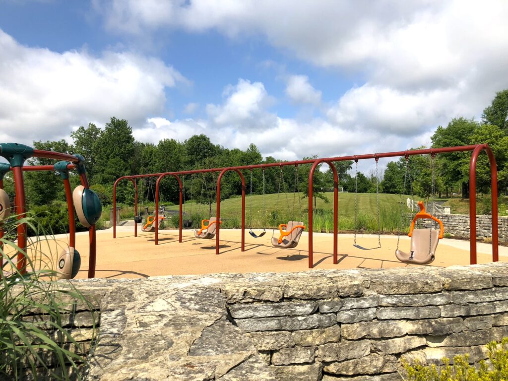 Regular swings and toddler swings at Millstone Creek Park.