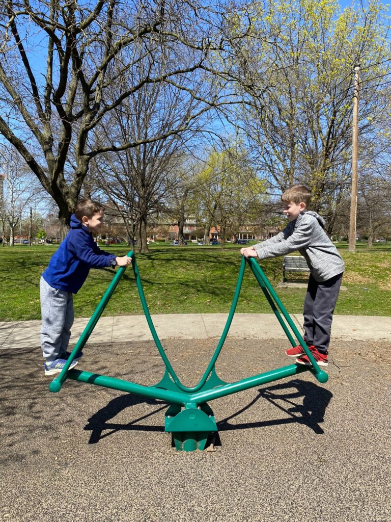 Two boys on the teeter-totter at Goodale Park.
