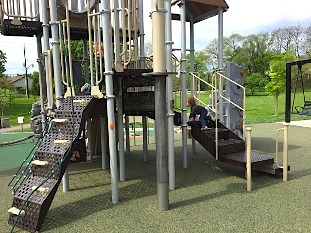 A drop down elevator on the play structure in the playground.