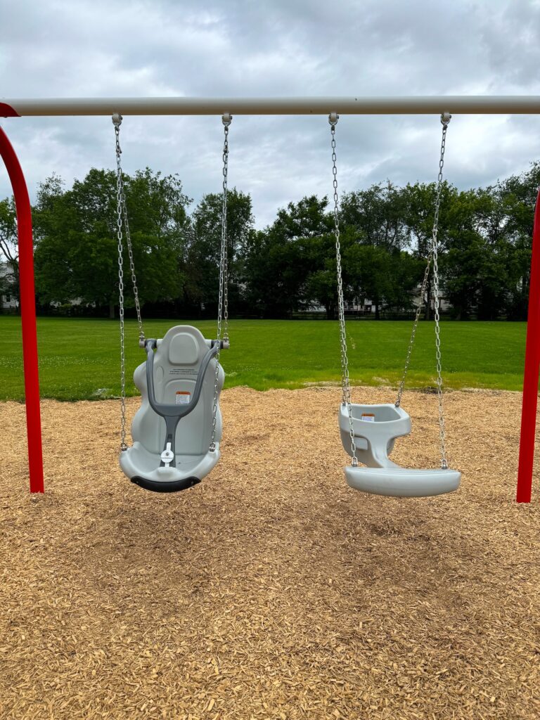 An accessible swing and a face-to-face swing.