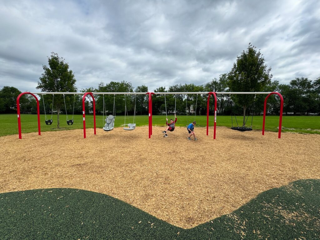 A set of 7 different kinds of swings at McCorkle Park.