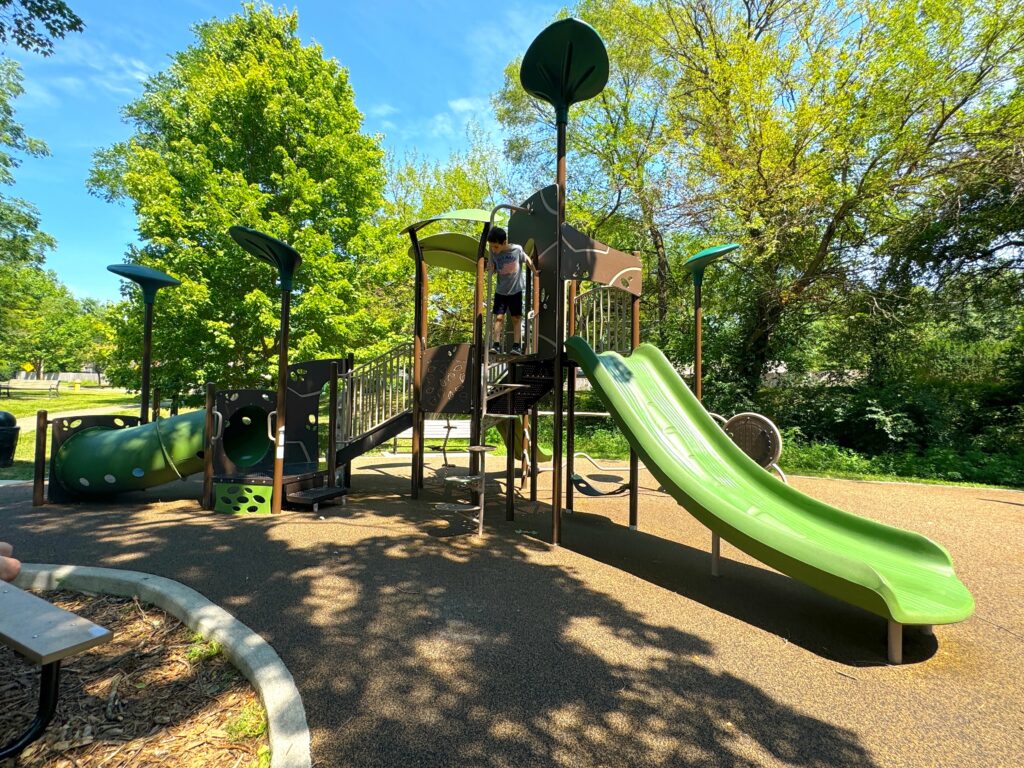 A long slide and tunnel for kids to play on.