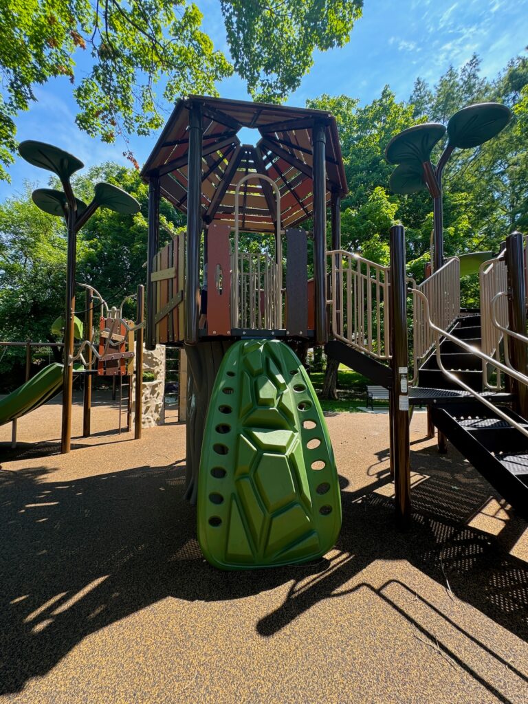 A climbing wall at the playground.