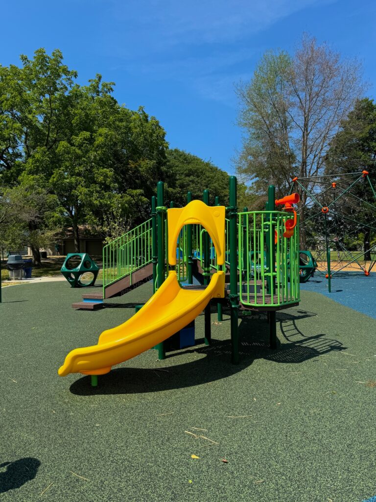 A play structure for toddlers at the park.